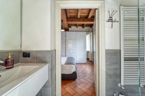 a bathroom with a sink and a shower in a room at CASA DI MILO in Cernobbio