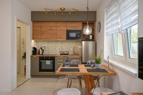 Dapur atau dapur kecil di Silentium Family Apartman Sárvár