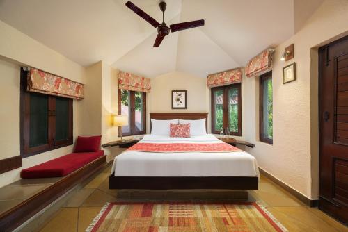 a bedroom with a bed and a ceiling fan at The Riverview Retreat Corbett by Leisure Hotels in Garjia