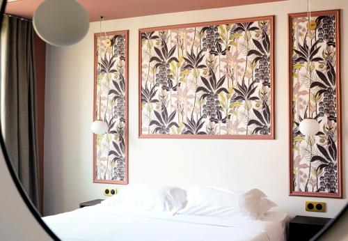 Postel nebo postele na pokoji v ubytování Hôtel Fesch & Spa