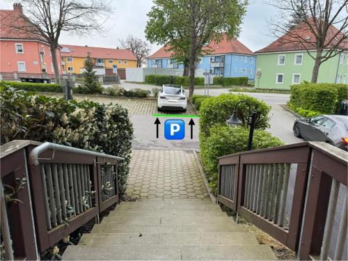 a gate with a parking sign in front of a parking lot at VALEMI BohoChic I 2BR 6PAX I TopLage I Parkplatz I Balkon I Küche in Landsberg am Lech