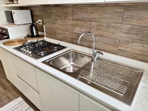 Η κουζίνα ή μικρή κουζίνα στο La Coccinella Turin apartment