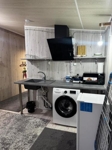 Kuchyň nebo kuchyňský kout v ubytování Отель