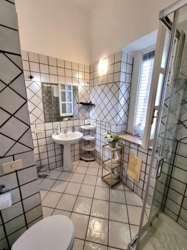 a bathroom with a toilet and a sink at Gente di Mare in Maratea