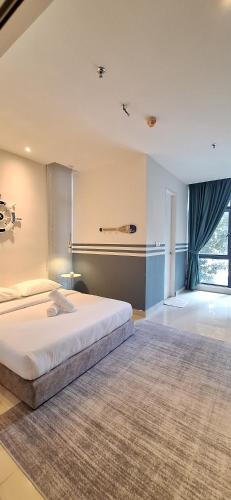a large bedroom with a large bed and a window at FAHomestay in Kota Kinabalu