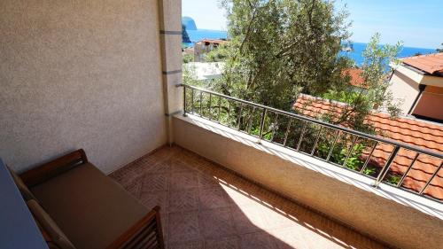 a balcony of a building with a view of the ocean at Medin Apartments BluVista in Petrovac na Moru