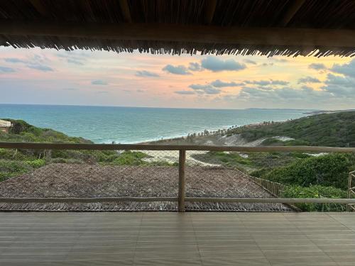 a view of the ocean from a balcony at Casa Amar Pipa in Pipa