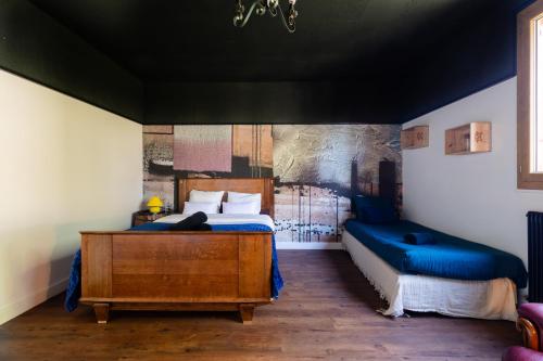 a bedroom with a bed and a dresser in a room at Villa Vercingétorix - groupe, Billard - Jacuzzi Spa in Romagnat
