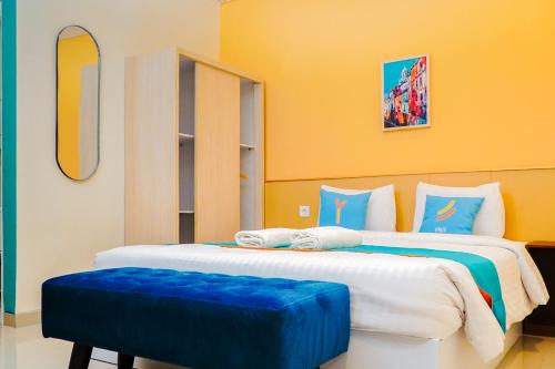 Postel nebo postele na pokoji v ubytování Sans Hotel Elrose Place