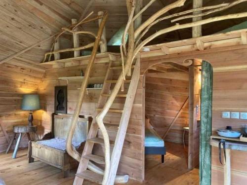 a room with a bunk bed in a log cabin at Camping 3 étoiles - eed0ca in Priziac