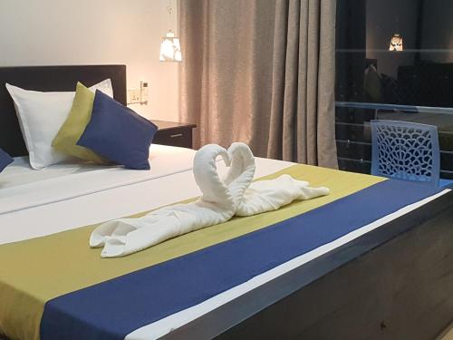 Ένα ή περισσότερα κρεβάτια σε δωμάτιο στο Villa Emerald & YALA safari