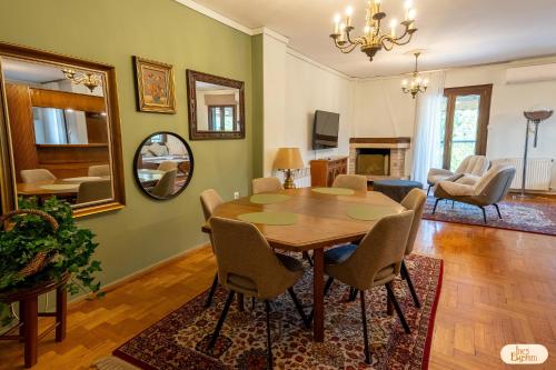 a dining room with a table and chairs at Ines Elysium in Kastoria