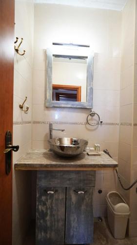 a bathroom with a sink and a mirror at Medin Apartments BluVista in Petrovac na Moru