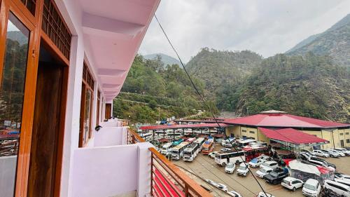 a view from a balcony of a parking lot at Hotel Travelling Stand in Sonprayag