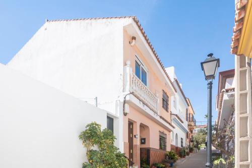 a street in a town with white buildings at Apartamento Sotogrande in Pueblo Nuevo de Guadiaro