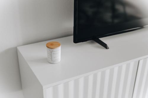 a roll of tape and a television on a white table at Calpe Bay in Calpe