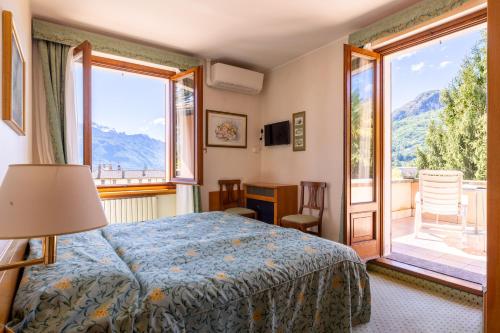 Postel nebo postele na pokoji v ubytování Hotel Royal
