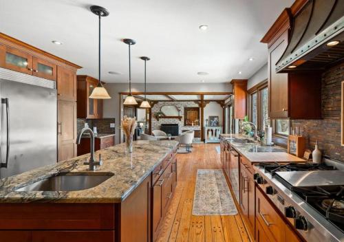 a large kitchen with wooden floors and a counter top at Unique Estate 5 Bedrooms Fire Pit Sleeps 10 in Akron