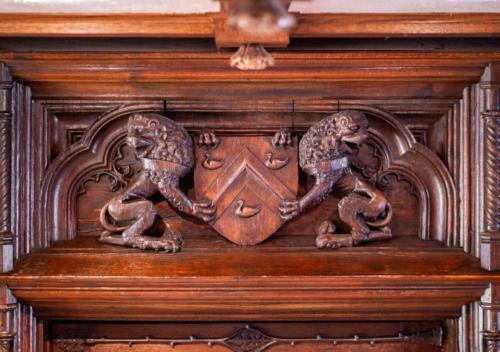 a wood carving of two snakes on a wall at Unique Estate 5 Bedrooms Fire Pit Sleeps 10 in Akron