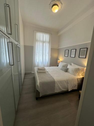 a bedroom with a large bed and a window at elan RESIDENCE in Athens