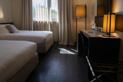 Postel nebo postele na pokoji v ubytování G Hotel Ancona