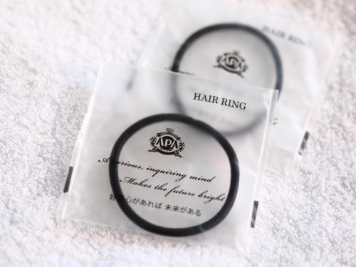 two wedding rings sitting on top of a white envelope at APA Hotel Shimbashi Toranomon in Tokyo