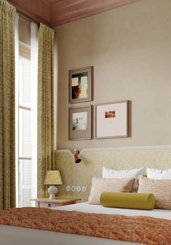 a bedroom with a bed and a window at Hôtel Amista Marseille - ancien Hôtel Saint Louis - Vieux Port in Marseille