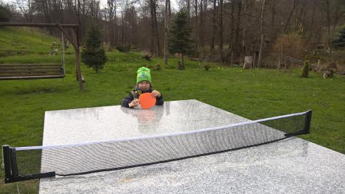 a baby is sitting on top of a trampoline at Indywidualne Gospodarstwo Rolne Agroturystyka Gościniec Pod Czeremchą Małgorzata Szczepanek in Stronie Śląskie