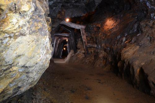 a tunnel in a cave with a stairway at Schloss Gravetsch in Villandro