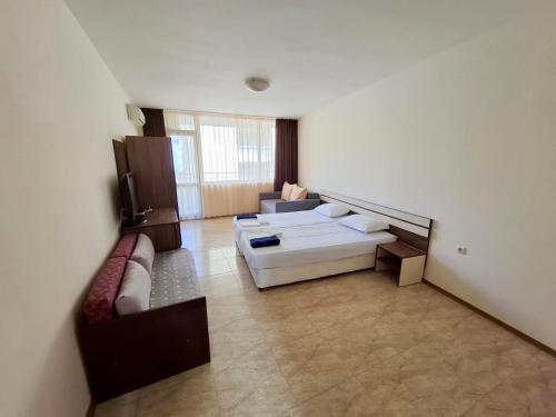 a living room with two couches and a couch at Stamopolu Apartments in Primorsko