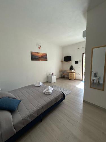 a bedroom with a bed and a living room at Istella in Posada