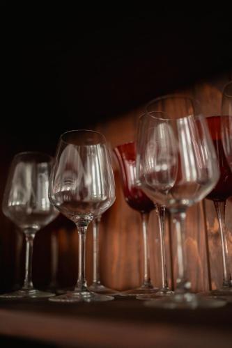 a group of wine glasses sitting on a table at Pensiunea Cocosel in Căstău