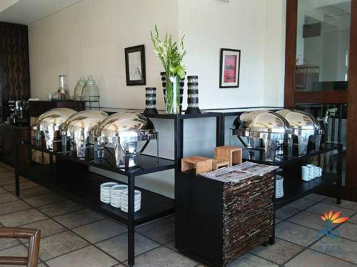 a display case with many glass jars and bowls at Azia Suites and Residences in Cebu City