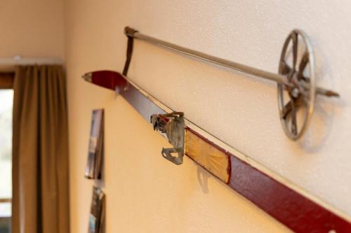 a metal object is hanging on a wall at Bergvilla Vivaldi - Happy Mountain Vibes in Mühlbach am Hochkönig