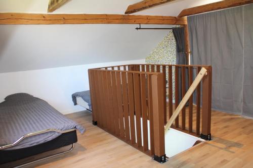 a room with a staircase and a bed in it at Apartment Gasstorp Wifi in Hova