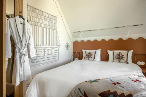 a bedroom with a large bed and a window at TatryTop Słoneczna Rezydencja Jacuzzi & Sauna in Białka Tatrzanska