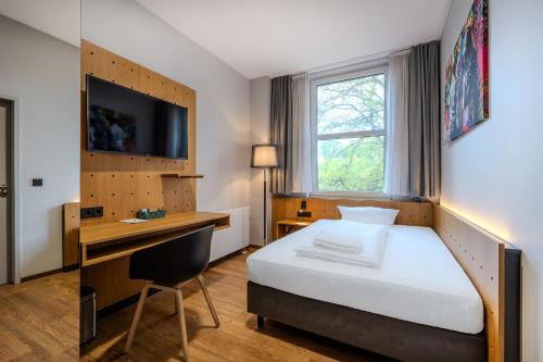 Postel nebo postele na pokoji v ubytování mk hotel berlin