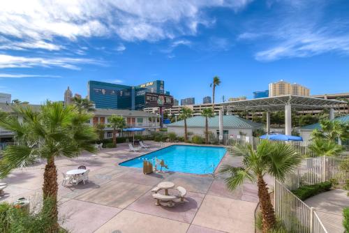 an overhead view of a pool with palm trees and buildings at Studio 6 Suites Las Vegas, NV - Tropicana in Las Vegas