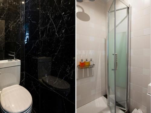 une salle de bain avec toilettes et douche en verre dans l'établissement Merveil - Luxury Suite - Louvre - Aboukir III, à Paris