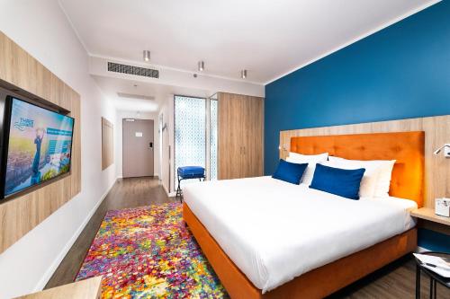 Postel nebo postele na pokoji v ubytování Three Corners Lifestyle Hotel