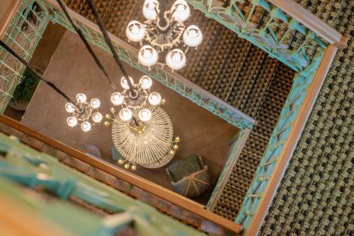 a chandelier hanging from a ceiling in a room at Nuvole Garden Hotel in Brunate