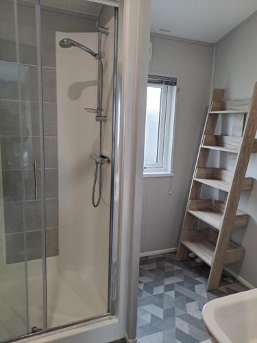 a shower with a glass door in a bathroom at Grange Leisure Park, Mablethorpe in Mablethorpe