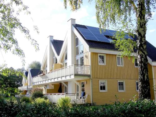 a house with solar panels on its roof at Ferienpark Scharmützelsee in Wendisch Rietz