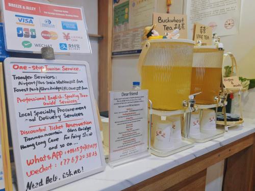 a table with a sign and a blender on it at Breeze Alley Inn--English reception-Tourism planing-Ticket reservation in Zhangjiajie