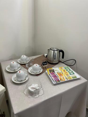 a table with a tea pot on top of it at Palazzo dei Baroni in San Bartolomeo in Galdo
