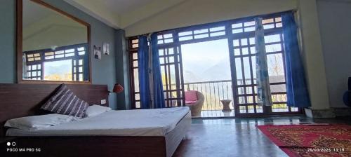 Cama o camas de una habitación en Ronglyang Villa Homestay Near MG Road