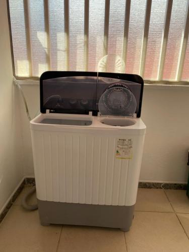 a radio sitting on top of a trash can at Casa 1090 ubicada cerca a todo. in Leticia