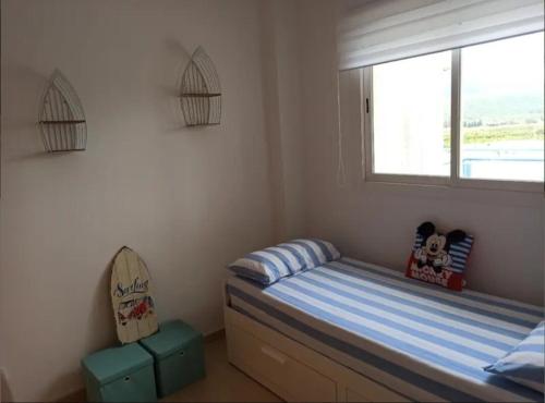Ένα ή περισσότερα κρεβάτια σε δωμάτιο στο Apartamento Denia Deveses