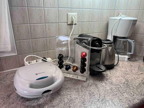 a kitchen counter with a toaster and a coffee maker at Big Two-Storey House up to 8 person in Ayía Sofía