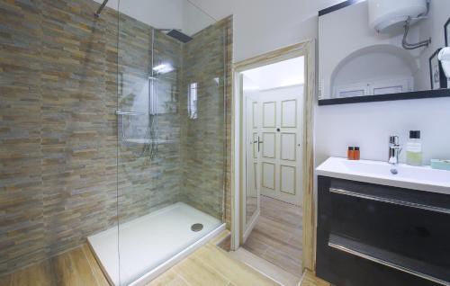 a bathroom with a shower with a glass door at Apartments Florence - Rosa piccolo in Florence